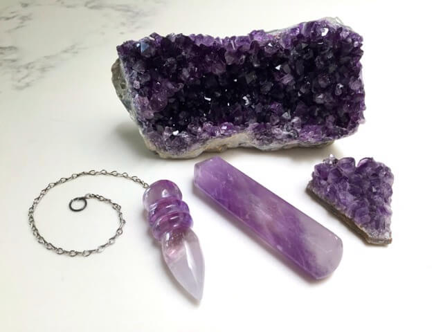 An amethyst gemstone on white background