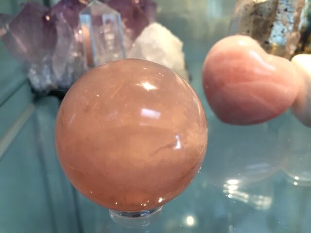 Rose quartz sphere and heart gemstones