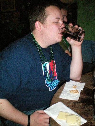 Dan McGrogan sips beer at a bar in winter 2010