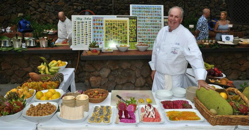 Ken Love at an exotic fruit station, containing some of the choicest fruits