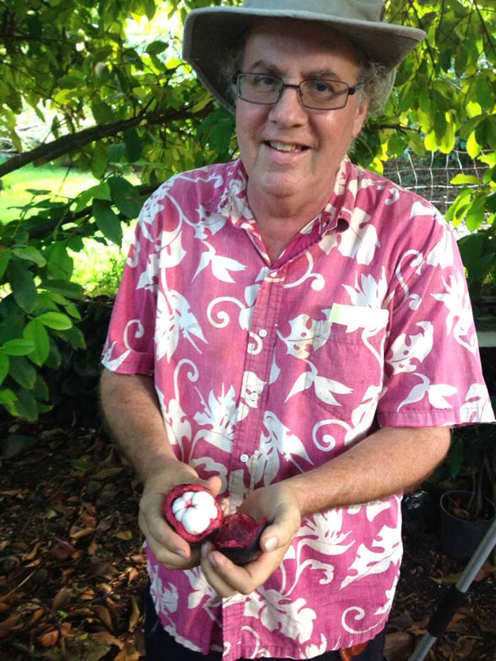 Ken Love holds fruit in August 2014