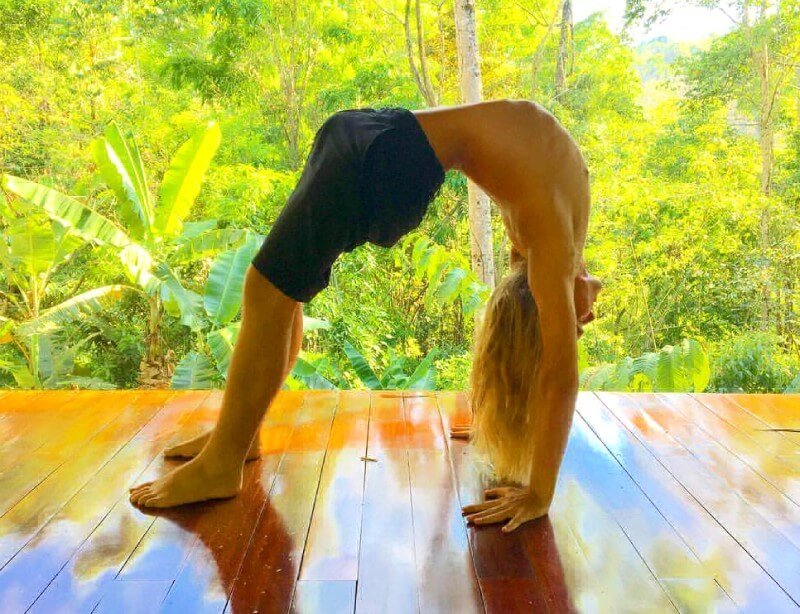 Nicolas Dudet practices yoga