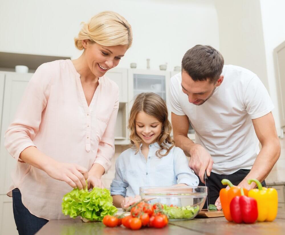 Diet Guide - Fruitarian Diet - Fruit Diet - Low-Fat Raw Vegan Diet - Family Preparing Salad In Kitchen - Fruit-Powered