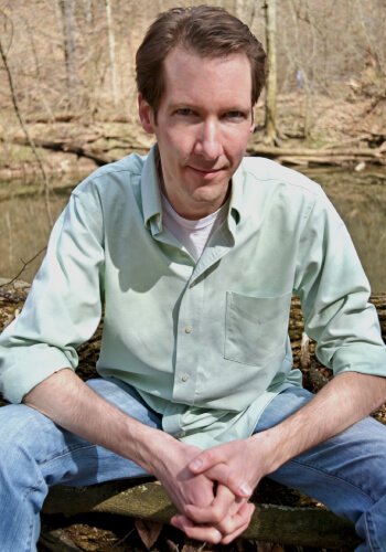 About Fruit-Powered - about Brian Rossiter - holistic health coach - sitting in woods
