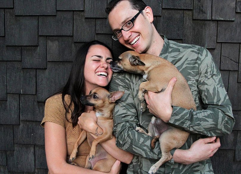 Charley Hinchcliffe and Jesi DiPalo holding dogs - Fruit-Powered