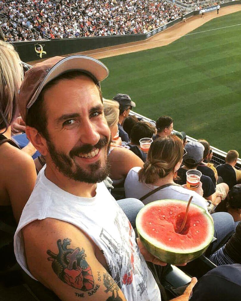 TJ Long eating watermelon at a baseball game - Raw Vegan Transformations - Fruit-Powered
