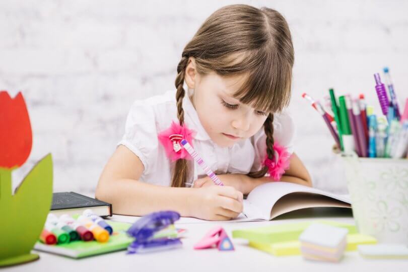 Why is my baby so fussy - girl doing homework - Gillespie Approach–Craniosacral Fascial Therapy - Fruit-Powered