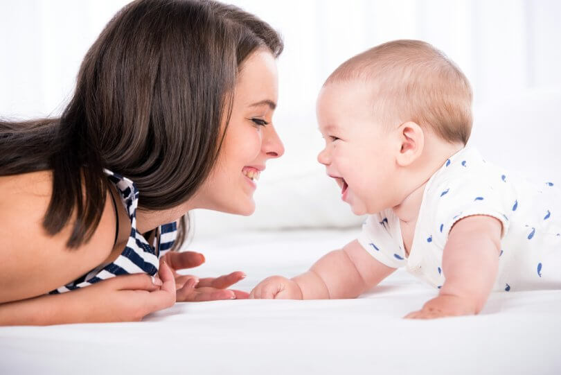 Why is my baby so fussy - mother and baby laughing - Gillespie Approach–Craniosacral Fascial Therapy - Fruit-Powered